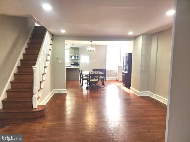 dining room with stairs, recessed lighting, dark wood-style floors, and baseboards