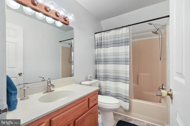 full bathroom with toilet, vanity, and shower / bath combo