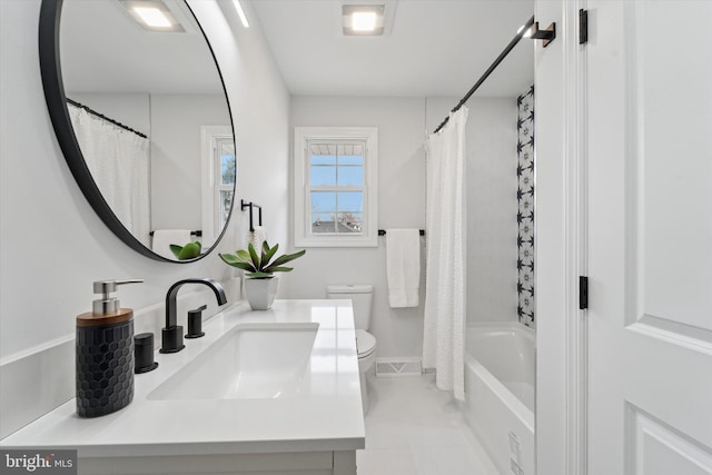 bathroom with shower / tub combo with curtain, toilet, vanity, and visible vents