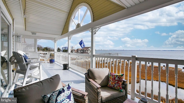 wooden deck with a water view