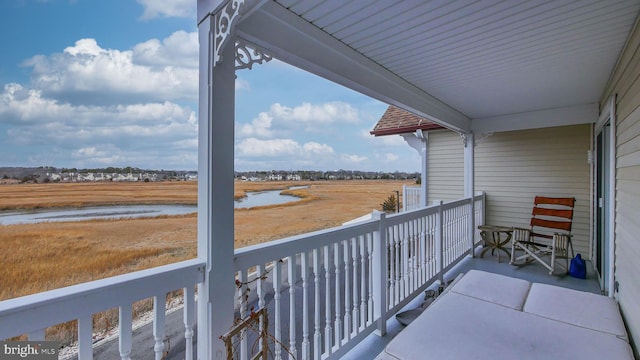 balcony featuring a water view