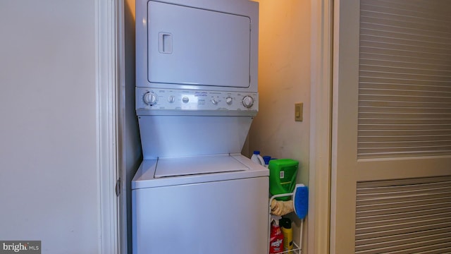 laundry area with laundry area and stacked washer and dryer