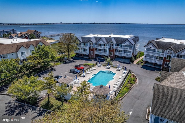 bird's eye view featuring a water view and a residential view