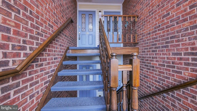 stairway with brick wall