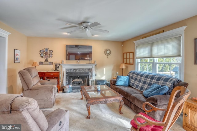 living area featuring carpet flooring and a fireplace