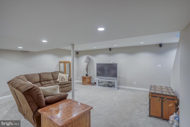 living area featuring recessed lighting, baseboards, and light colored carpet