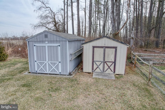 view of shed with fence