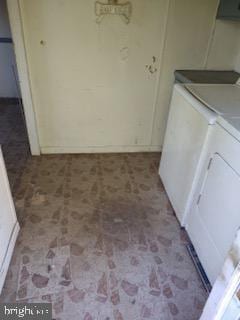 clothes washing area with laundry area and separate washer and dryer