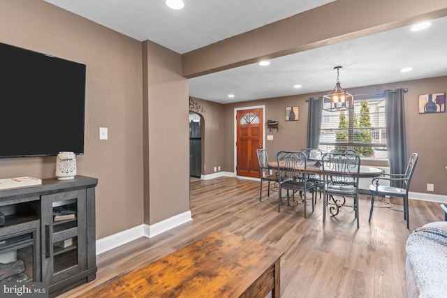 dining area featuring recessed lighting, wood finished floors, and baseboards