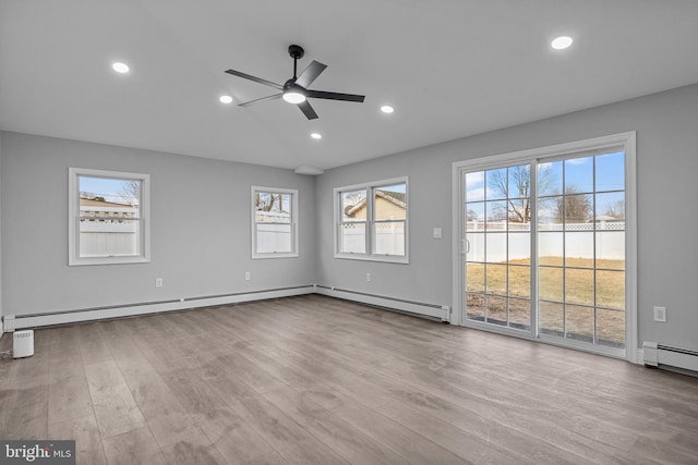 unfurnished living room with recessed lighting, a baseboard radiator, wood finished floors, and a ceiling fan