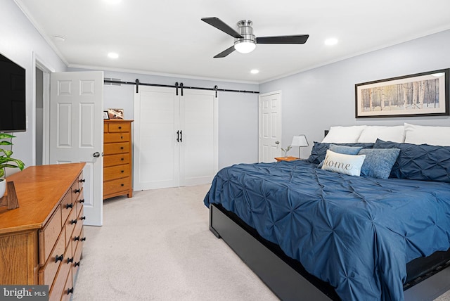 bedroom with recessed lighting, a barn door, ornamental molding, and a ceiling fan