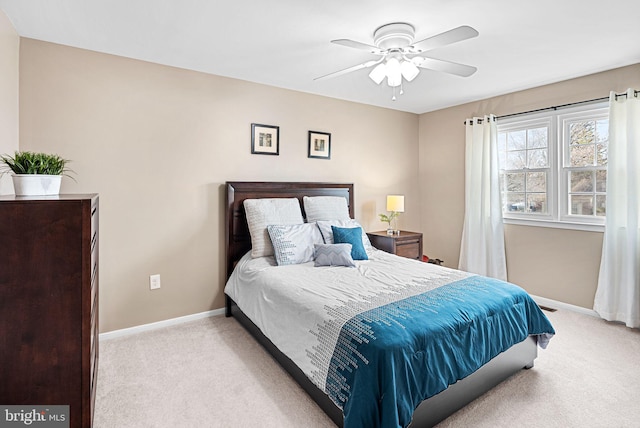 bedroom with baseboards, carpet, and a ceiling fan