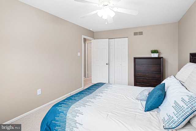 bedroom featuring visible vents, baseboards, carpet, and ceiling fan