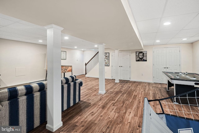 playroom featuring recessed lighting, a paneled ceiling, baseboards, and wood finished floors