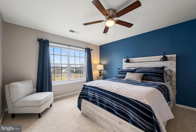 bedroom with visible vents, ceiling fan, baseboards, and carpet