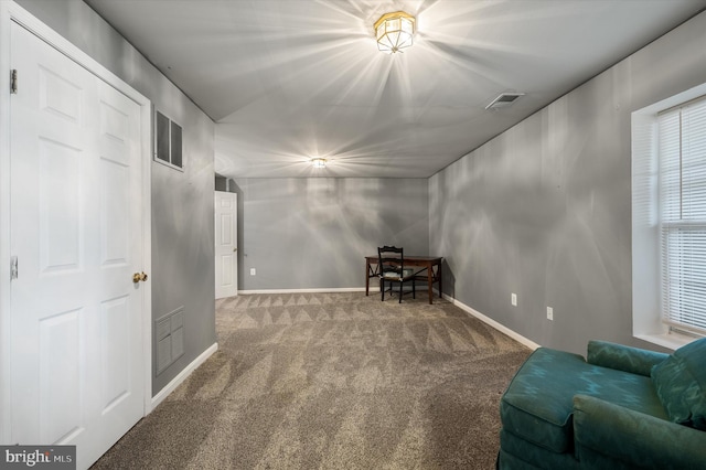 unfurnished room featuring visible vents, baseboards, and carpet flooring