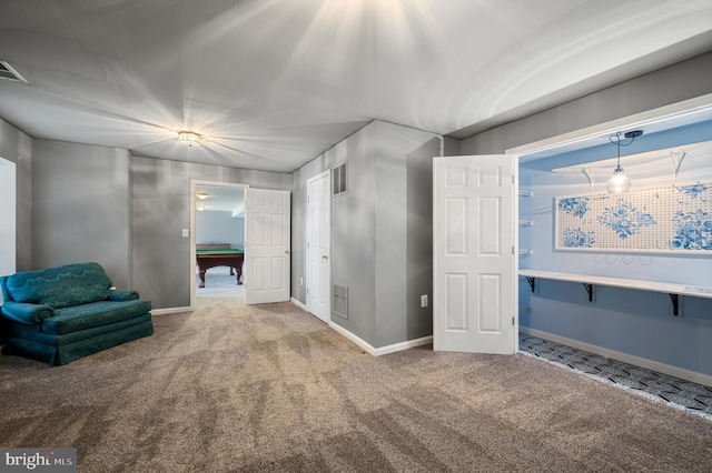 sitting room featuring visible vents, baseboards, and carpet