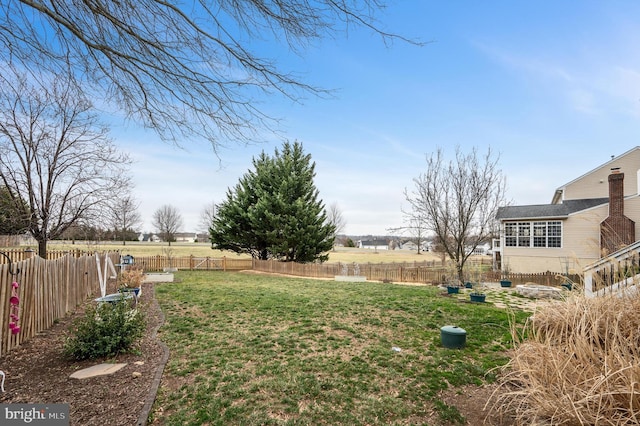 view of yard with a fenced backyard