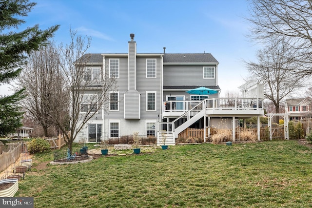 rear view of house with stairway, a wooden deck, a yard, a fenced backyard, and a chimney