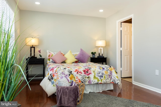 bedroom with recessed lighting, baseboards, and wood finished floors