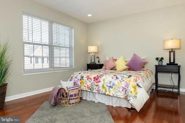 bedroom with recessed lighting, baseboards, and wood finished floors