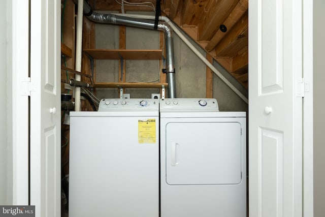 clothes washing area featuring laundry area and separate washer and dryer