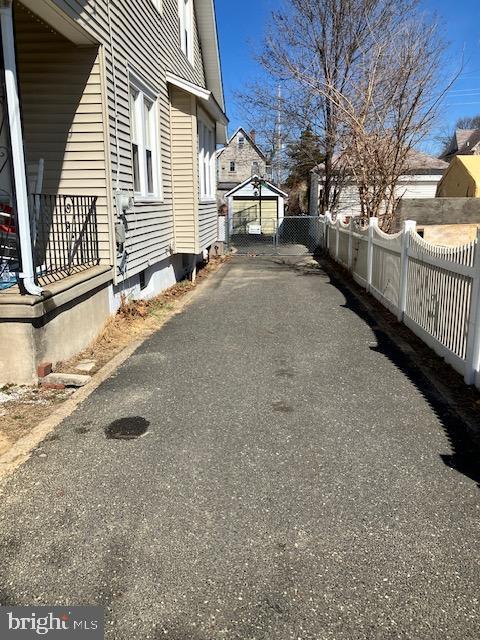 view of street with aphalt driveway