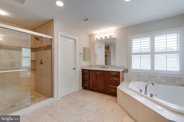 full bath with vanity, recessed lighting, visible vents, a garden tub, and a stall shower