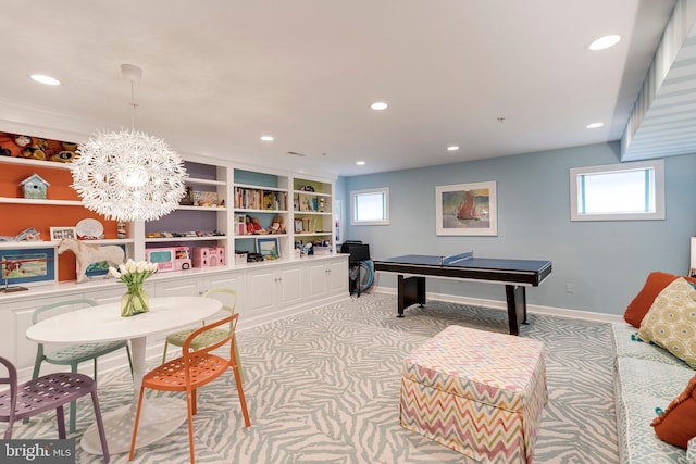 playroom with recessed lighting, baseboards, an inviting chandelier, and light carpet