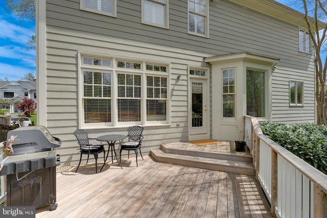 wooden deck featuring grilling area