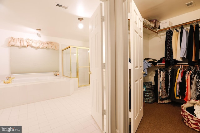 walk in closet with tile patterned floors and visible vents