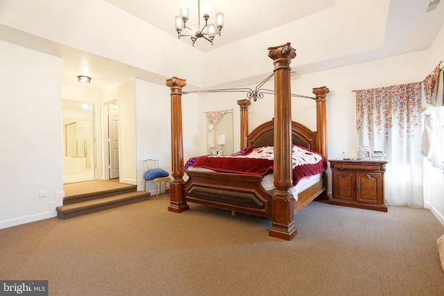 bedroom featuring a notable chandelier, a raised ceiling, baseboards, and carpet floors