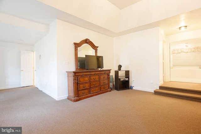 bedroom with carpet and baseboards