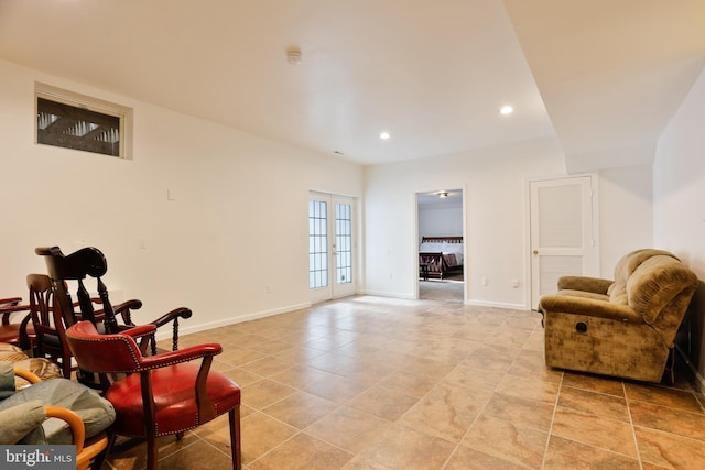 living area with light tile patterned flooring, recessed lighting, french doors, and baseboards