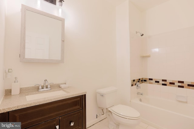 bathroom featuring tile patterned flooring, shower / tub combination, toilet, and vanity