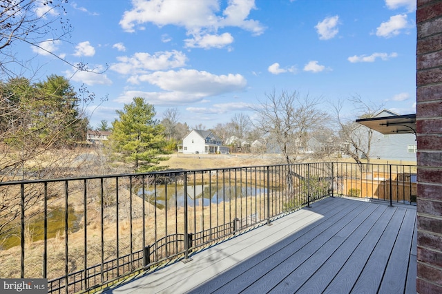 wooden deck with a water view