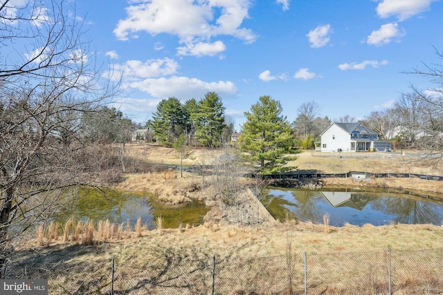 view of water feature featuring fence