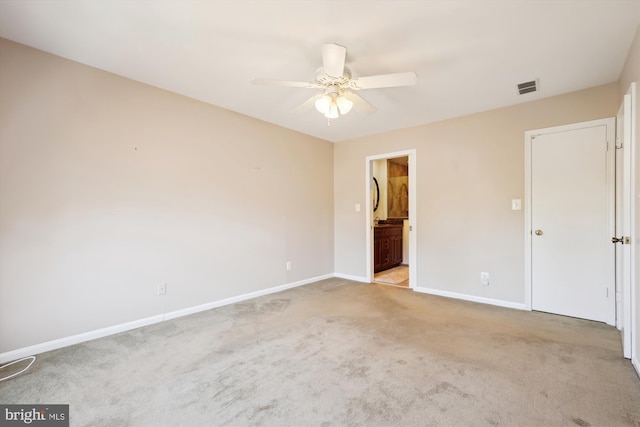 unfurnished bedroom with a ceiling fan, baseboards, visible vents, carpet flooring, and connected bathroom