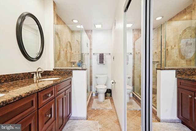 full bathroom with vanity, recessed lighting, a stall shower, tile patterned flooring, and toilet