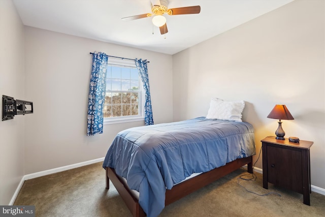 carpeted bedroom featuring ceiling fan and baseboards