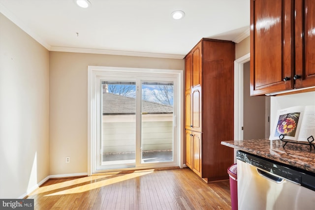 kitchen featuring ornamental molding, recessed lighting, light wood-style floors, baseboards, and dishwasher