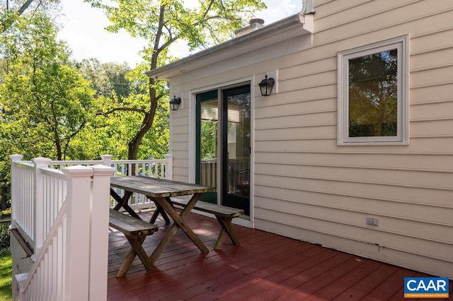 wooden terrace with outdoor dining area