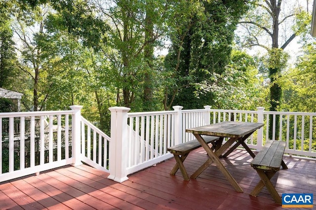 wooden terrace featuring outdoor dining space