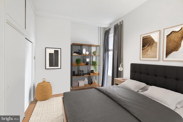 bedroom with wood finished floors