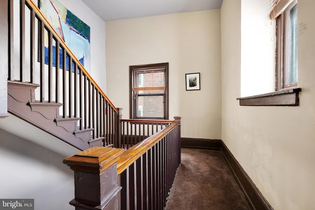 stairs with carpet flooring and baseboards