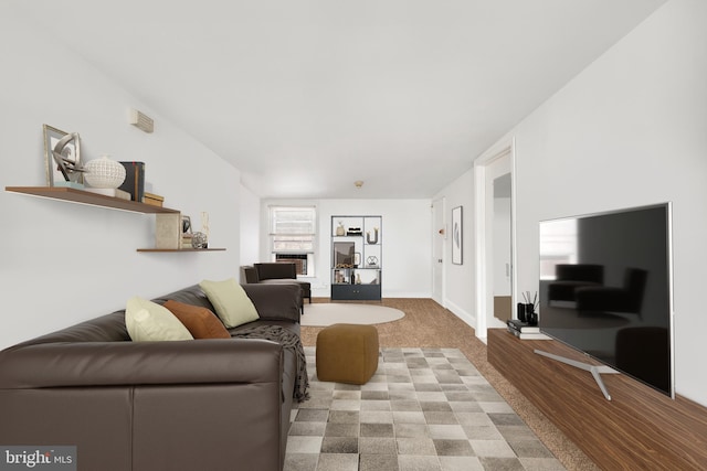 living room with baseboards and wood finished floors