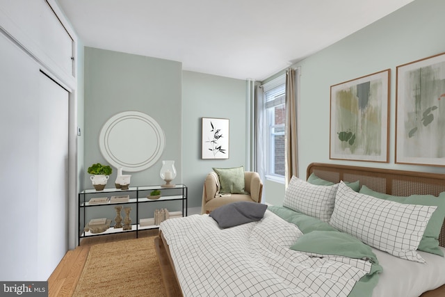 bedroom featuring wood finished floors