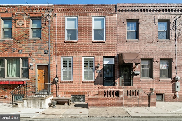 multi unit property featuring brick siding