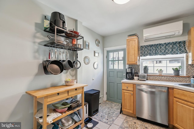 kitchen featuring decorative backsplash, a healthy amount of sunlight, a wall unit AC, and stainless steel dishwasher