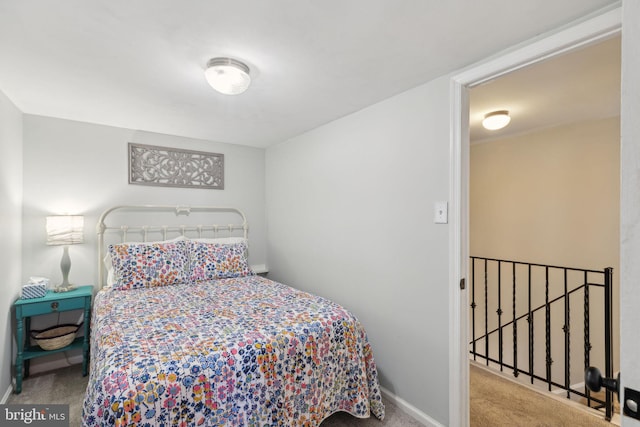 carpeted bedroom with baseboards